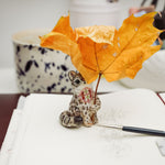 Snow Leopard - hold my leaf - figurine