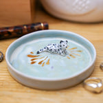 Ceramic jewelry tray with a Snow Leopard