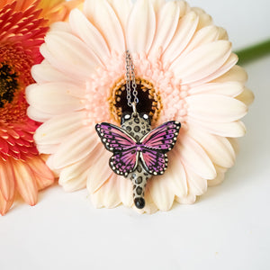 Snow leopard with butterfly wings pendant