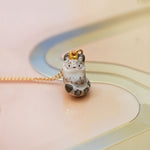 Snow Leopard with the gold Moon pendant