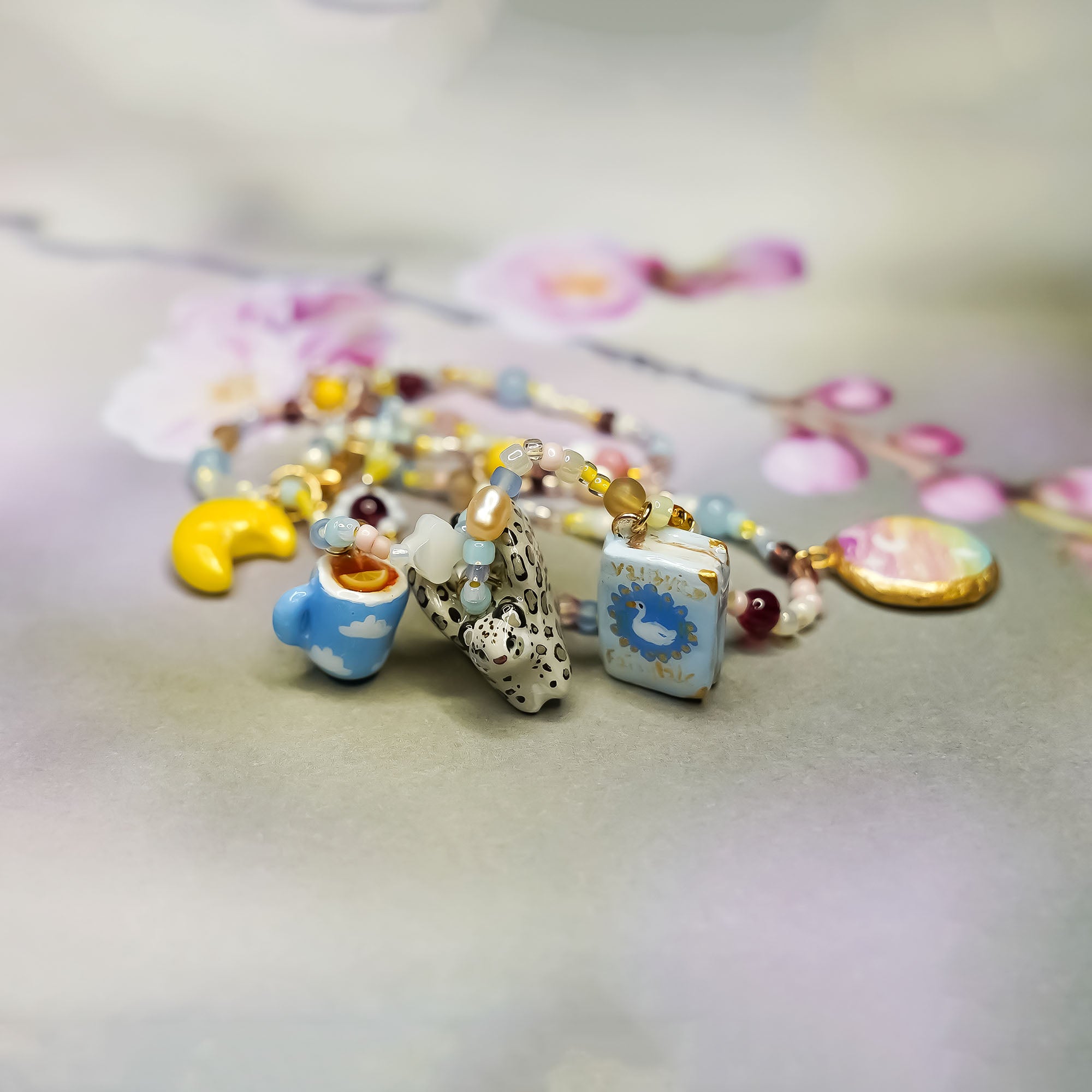 Snow leopard with wings - necklace with charms