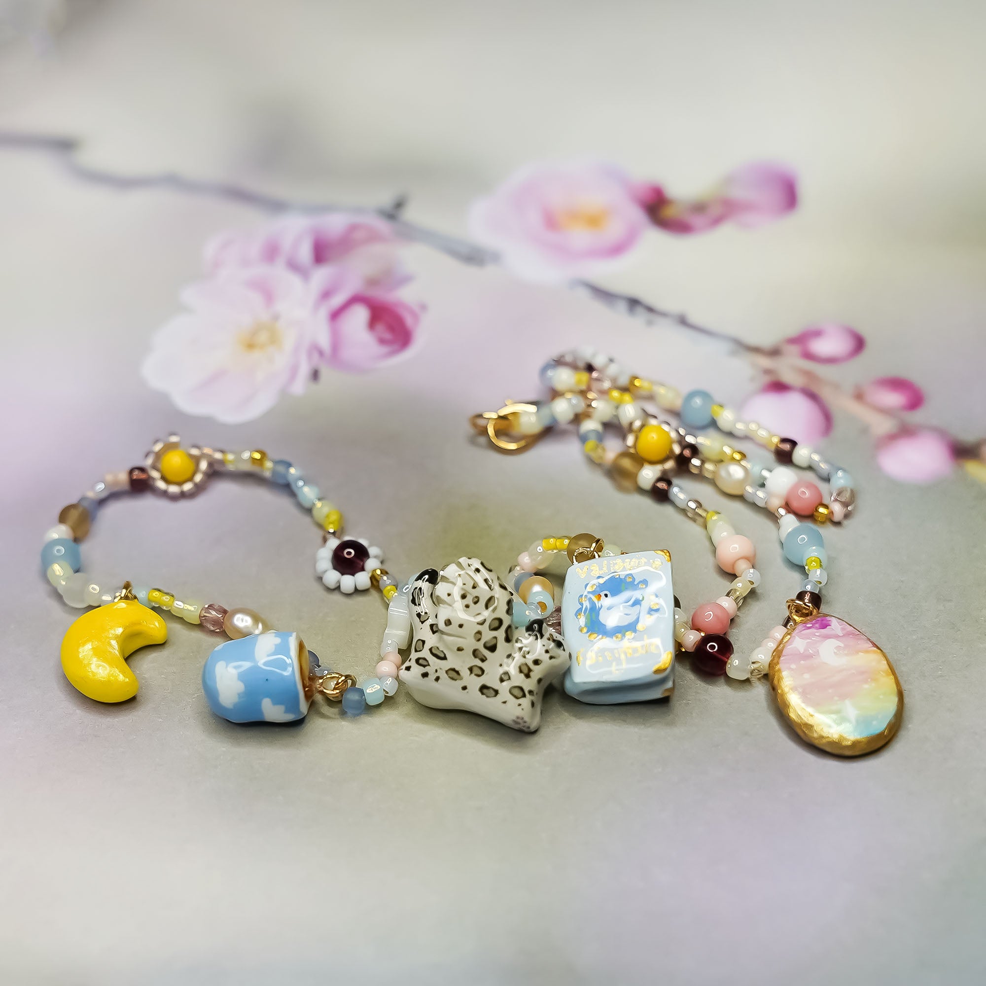 Snow leopard with wings - necklace with charms