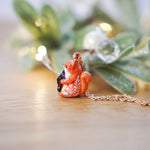 Squirrel with a gingerbread tree pendant