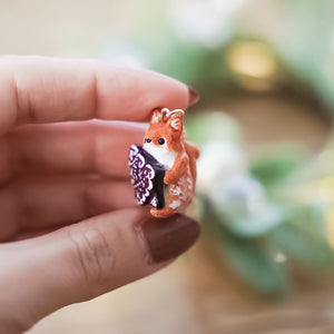 Squirrel with a gingerbread tree pendant