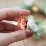 Squirrel with a gingerbread tree pendant
