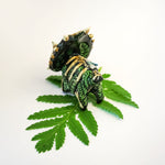 Styracosaurus with sunstone fossil figurine