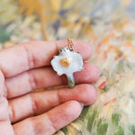 Sugar glider with a gold heart pendant