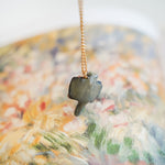 Sugar glider with a gold heart pendant