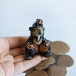 Sun bear with red pandas! figurine