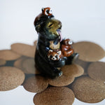 Sun bear with red pandas! figurine