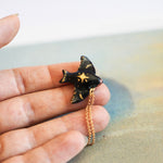 Swallow with a star pendant