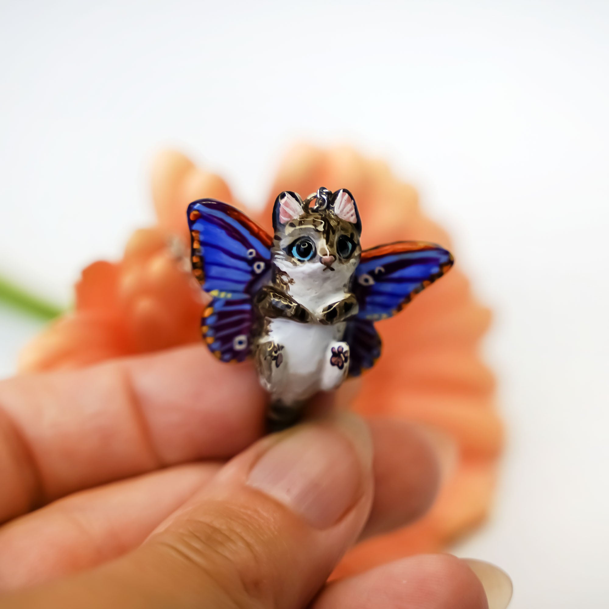 Tabby cat with moth wings pendant