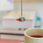 Neon Tetra with a silver star pendant