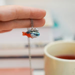 Neon Tetra with a silver star pendant