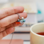 Neon Tetra with a silver star pendant