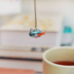 Neon Tetra with a silver star pendant