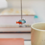 Neon Tetra with a silver star pendant