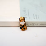 Tiger with a star pendant