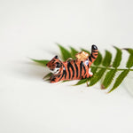 Tiger with a star pendant