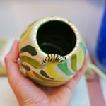 Ceramic vase with a little tiger