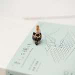 Long-tiled tit with a star pendant