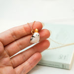 Long-tiled tit with a star pendant