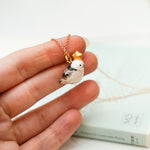 Long-tiled tit with a star pendant