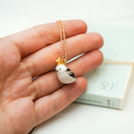 Long-tiled tit with a star pendant