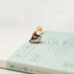 Long-tiled tit with a star pendant