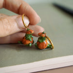 T-rex in the pumpkins earrings