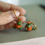 T-rex in the pumpkins earrings