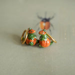 T-rex in the pumpkins earrings