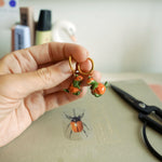T-rex in the pumpkins earrings