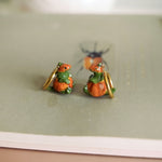 T-rex in the pumpkins earrings