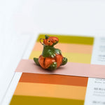 T-rex in a pumpkin pendant