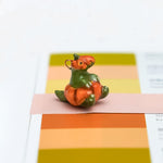 T-rex in a pumpkin pendant