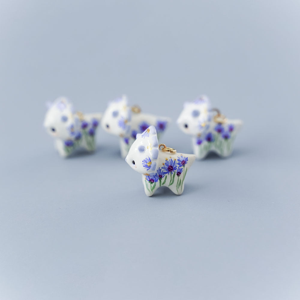 Triceratops with cornflowers pendant