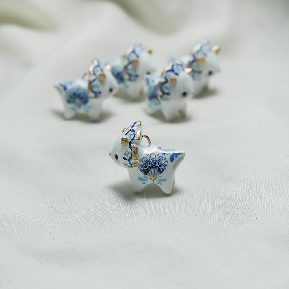 Triceratops with blue flowers pendant