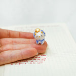 Triceratops with a star and porcelain pattern pendant