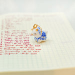 Triceratops with a star and porcelain pattern pendant