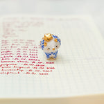 Triceratops with a star and porcelain pattern pendant