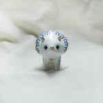 Triceratops with blue flowers figurine
