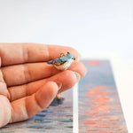 Tufted titmouse with a star pendant