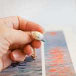 Tufted titmouse with a star pendant