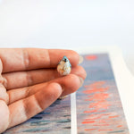 Tufted titmouse with a star pendant