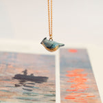 Tufted titmouse with a star pendant