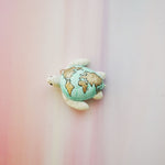 Sea turtle with the World map pendant