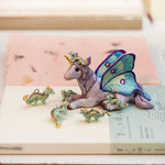 Unicorn with little dragons figurine