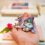 Unicorn with little dragons figurine