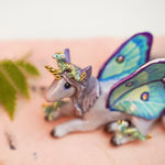 Unicorn with little dragons figurine